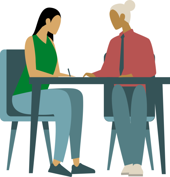 Two people signing a document